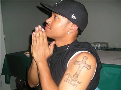 his tatt said In God We Trust.